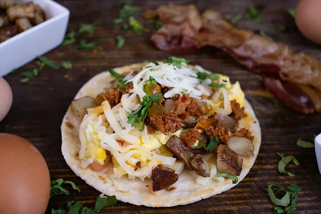 Breakfast taco with chorizo, egg, potato, cheese and cilantro at Cinco Más