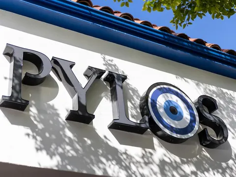Pylos restaurant sign and tiled roof in San Carlos