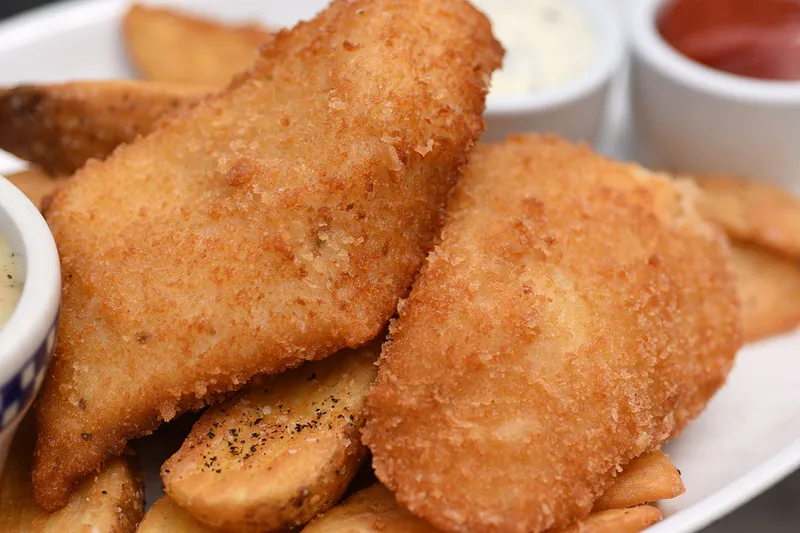 Battered halibut and chips with tartar sauce at Duke’s Seafood