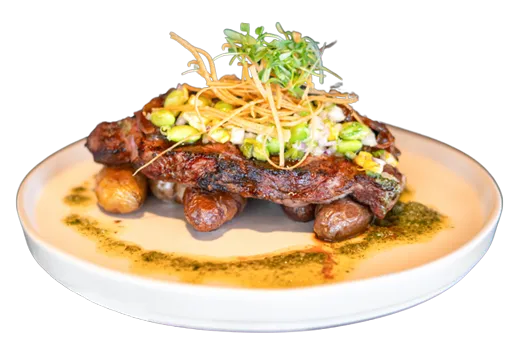 Grilled meat plate with vegetables at Woven Seafood & Chophouse