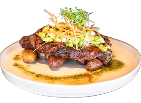 Grilled meat plate with vegetables at Woven Seafood & Chophouse