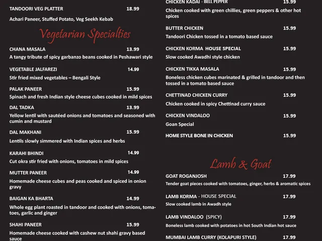 Awadh India Restaurant menu page listing grilled vegetables, vegetarian specialties, poultry, lamb, and goat dishes