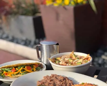 Mexican dishes served on an outdoor table at El Fenix