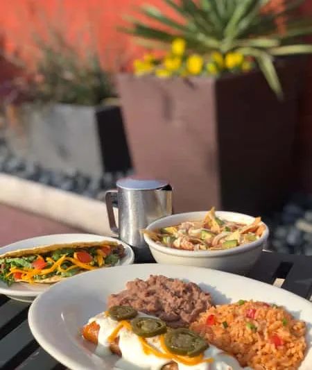 Mexican dishes served on an outdoor table at El Fenix