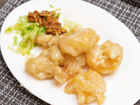 Plate of honey walnut prawns with candied walnuts and shredded lettuce at Harbor City Restaurant Tacoma