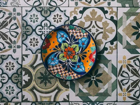 Decorative plate set on patterned tile at Mi Tocaya Antojería