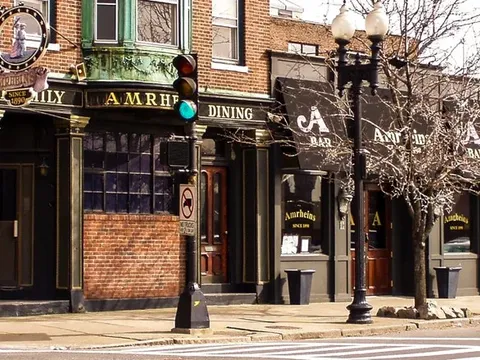 Corner exterior of Amrheins with its vintage sign in South Boston
