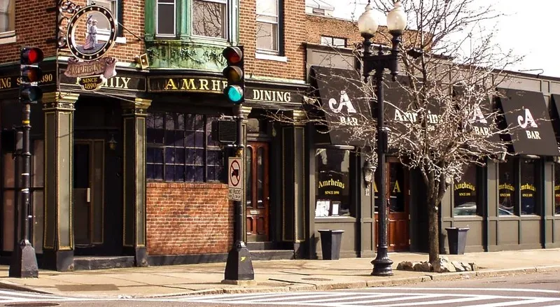 Corner exterior of Amrheins with its vintage sign in South Boston