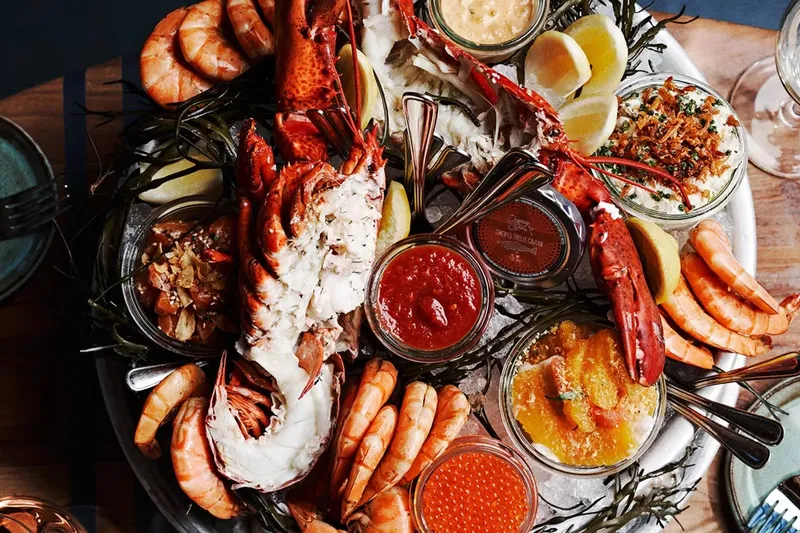 Seafood platter with lobster, shrimp, roe, lemons and sauces at The Optimist
