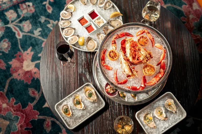 A seafood tower with oysters, crab, and lemon at Common Restaurant
