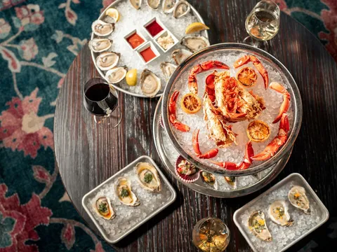 A seafood tower with oysters, crab, and lemon at Common Restaurant