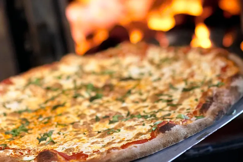 Pizza fresh out of the wood-fired oven at Centro
