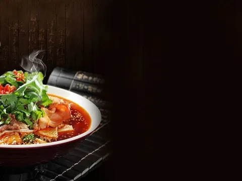 Steaming bowl of Sichuan boiled beef in chili broth topped with cilantro at Grand Szechuan in Bloomington