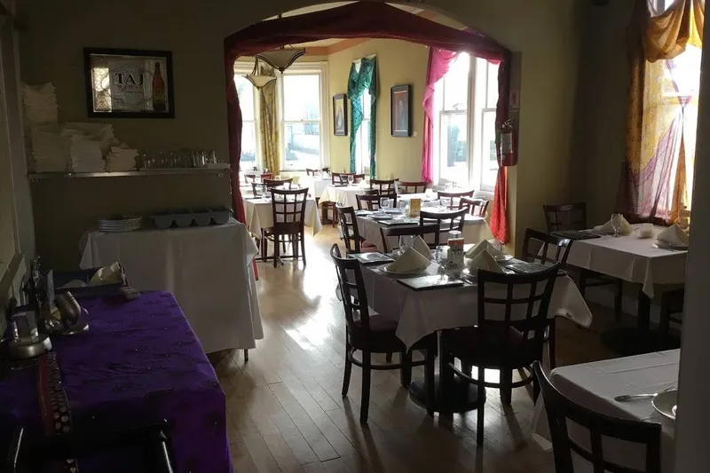 Dining room with set tables at Ark North Indian Cuisine