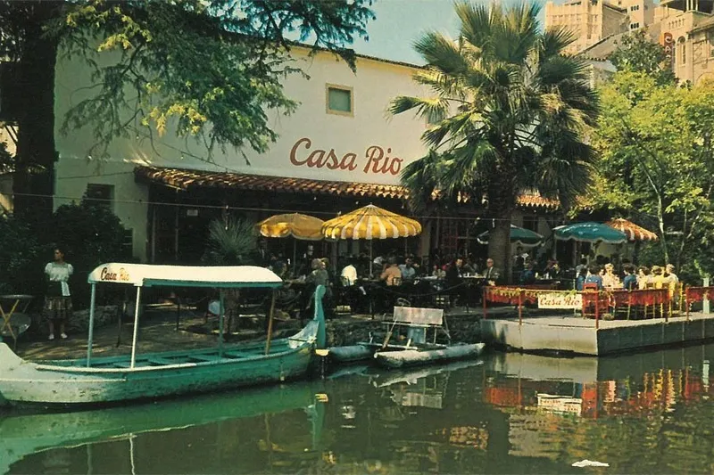 Historic photo of Casa Rio's River Walk patio and boat dock