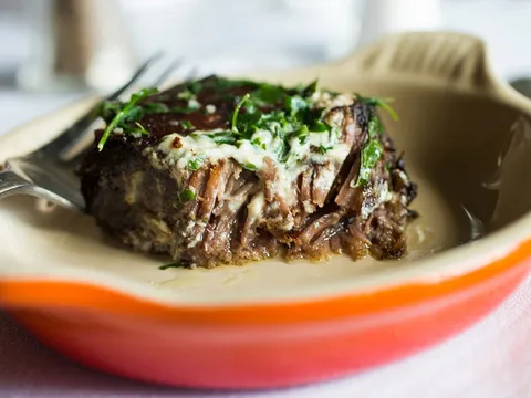 Braised beef short rib with salsa verde in a Le Creuset dish at Herbsaint