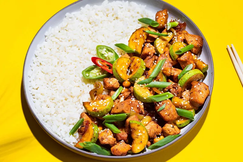 Stir-fried chicken with peppers over rice at Wu Liang Ye