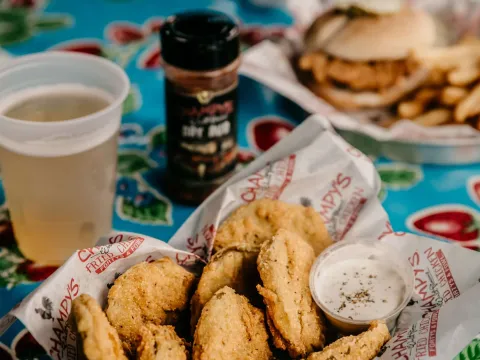 Fried pickles, a chicken sandwich, and a beer at Champy's Famous Fried Chicken