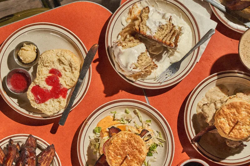 Biscuits, a cinnamon roll, and a biscuit sandwich at Denver Biscuit Company