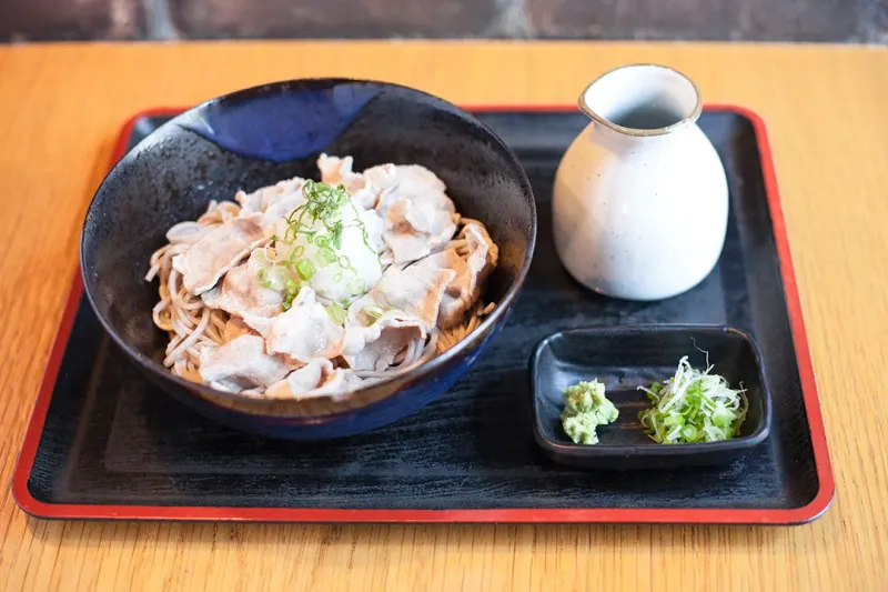 Cold Buta Shabu soba bowl with sliced pork and dipping sauce on a lacquer tray at Cocoron
