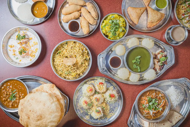 Overhead spread of South Indian vegetarian thali dishes at Shri Balaji Bhavan