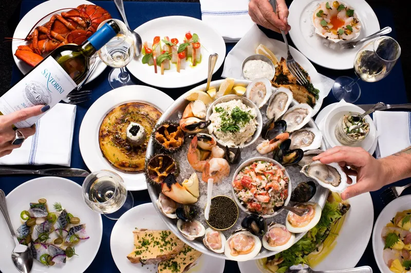 Raw bar seafood tower with oysters, lobster and caviar at Neptune Oyster