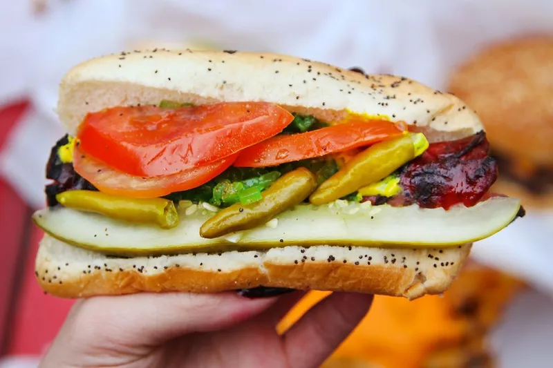 Char-grilled Chicago-style hot dog with all the toppings at The Wieners Circle