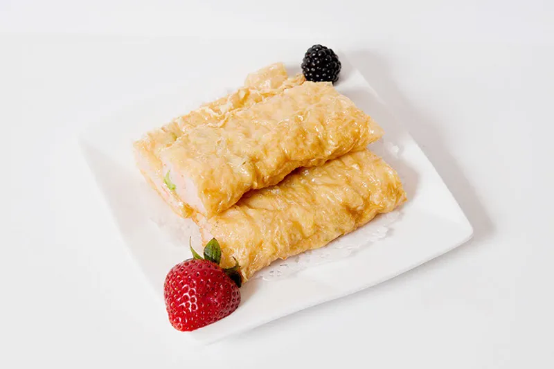 Fresh bean curd skin rolls stuffed with shrimp on a white plate at Asian Jewels Seafood Restaurant, Flushing