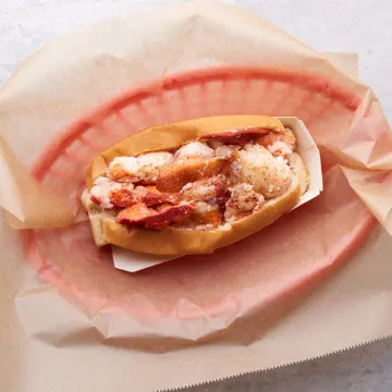 Luke's Lobster lobster roll in a paper-lined red basket