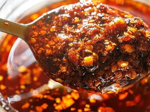 Spoonful of chili oil lifted from a jar at Yang Chow