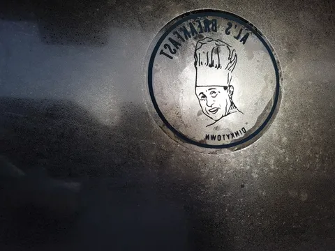 Al's Breakfast logo etched into the frosted front window of the Dinkytown diner in Minneapolis