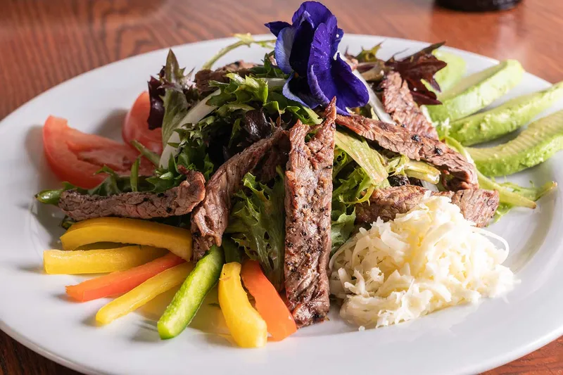 Grilled arrachera steak salad with avocado, peppers and cotija cheese at Blue Agave Club