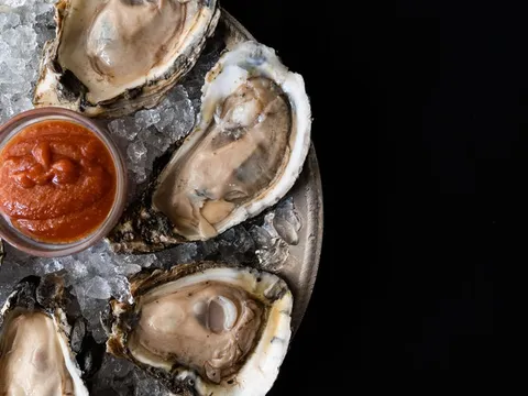 Oysters on ice with cocktail sauce at The Prime Rib