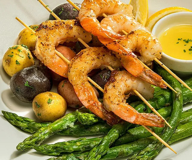 Grilled shrimp skewers with asparagus and potatoes at Sears Fine Food