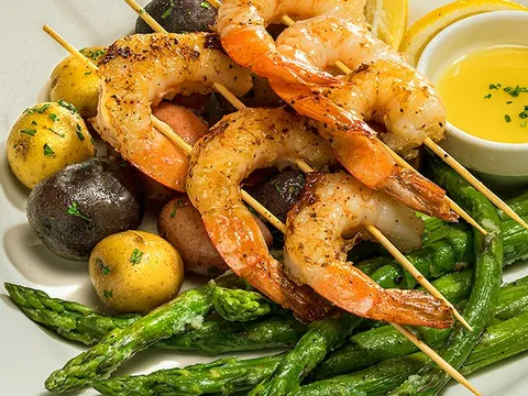 Grilled shrimp skewers with asparagus and potatoes at Sears Fine Food