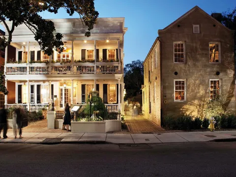Husk Charleston's historic Queen Street house at dusk