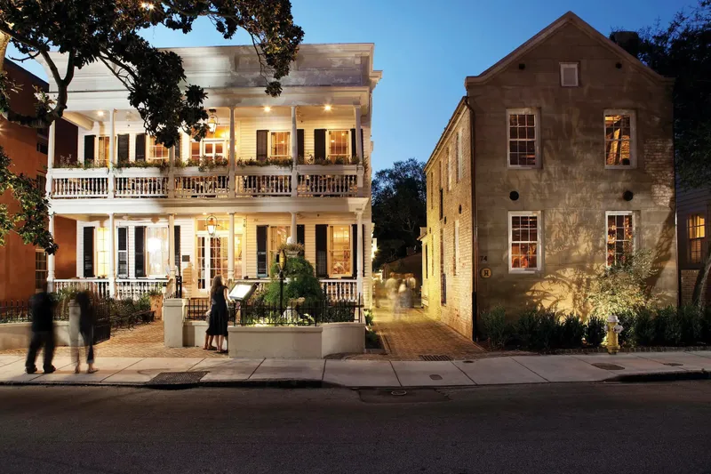 Husk Charleston's historic Queen Street house at dusk