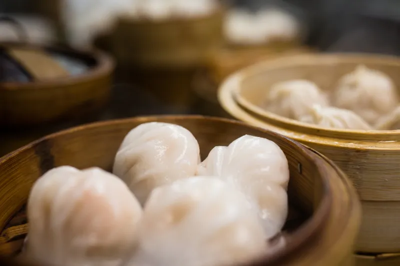 Steamed har gow shrimp dumplings in a bamboo steamer at Triple Crown Restaurant in Chicago's Chinatown