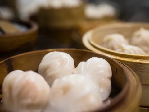 Steamed har gow shrimp dumplings in a bamboo steamer at Triple Crown Restaurant in Chicago's Chinatown