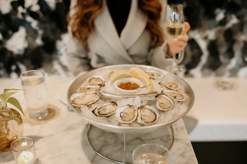 A platter of raw oysters on ice at Easy Bistro & Bar