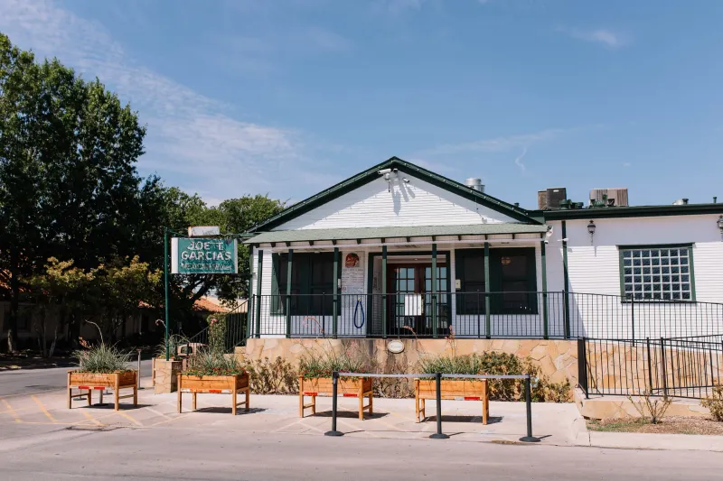 White-washed exterior and forecourt of Joe T. Garcia's