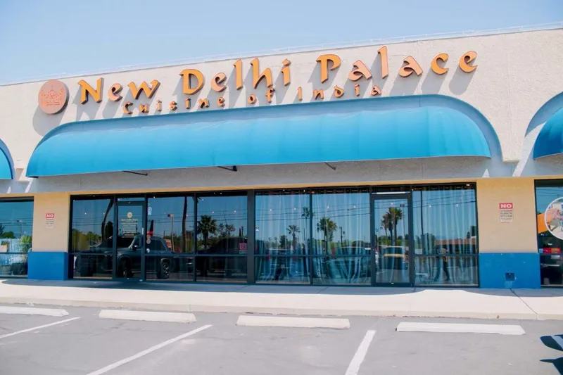 Blue-awninged storefront of New Delhi Palace on East Broadway Boulevard in Tucson