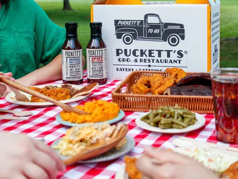 Fried chicken, ribs, and sides in a Puckett's to-go pack