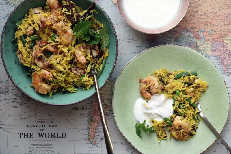 Minted shrimp pulao with green beans, mint and a bowl of yogurt, from Pondicheri in Houston