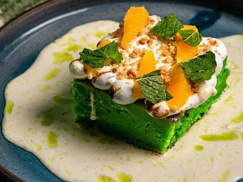 Green dessert topped with citrus, cream and mint at Lucky Danger