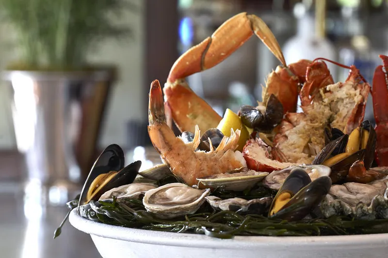 Bouchon Bistro's seafood tower of lobster, crab, oysters, clams, mussels and shrimp on ice at the bar