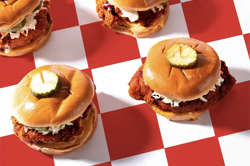Hot chicken sandwiches with pickles at Hattie B's Hot Chicken