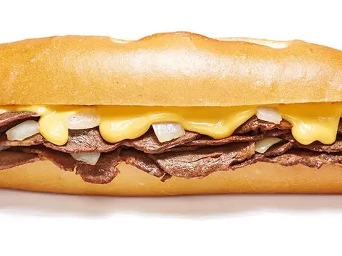 Cheesesteak with grilled onions and cheese at Geno's Steaks