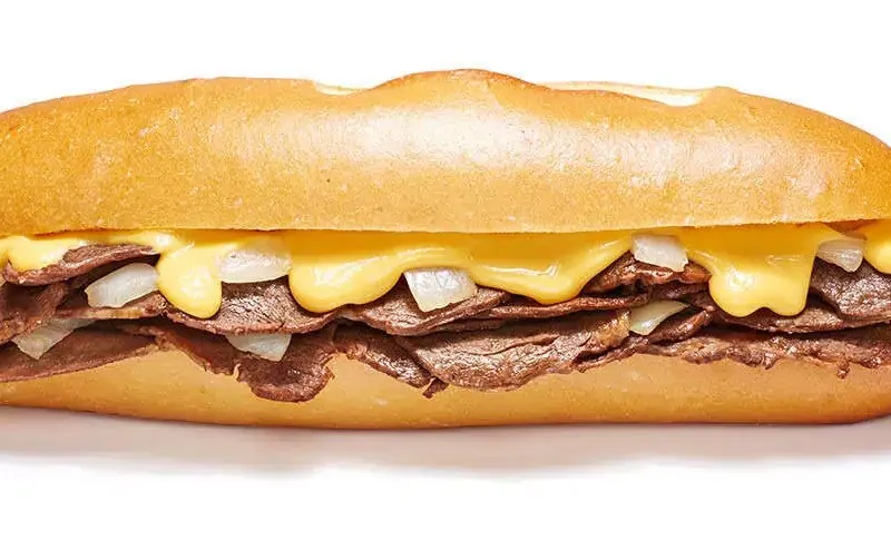 Cheesesteak with grilled onions and cheese at Geno's Steaks