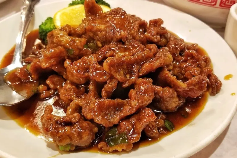 Plate of crispy fried pork in sauce at Lao Sze Chuan